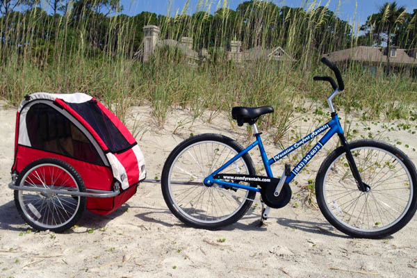 Adult bike on beach with child carrier Comfy Rentals 600