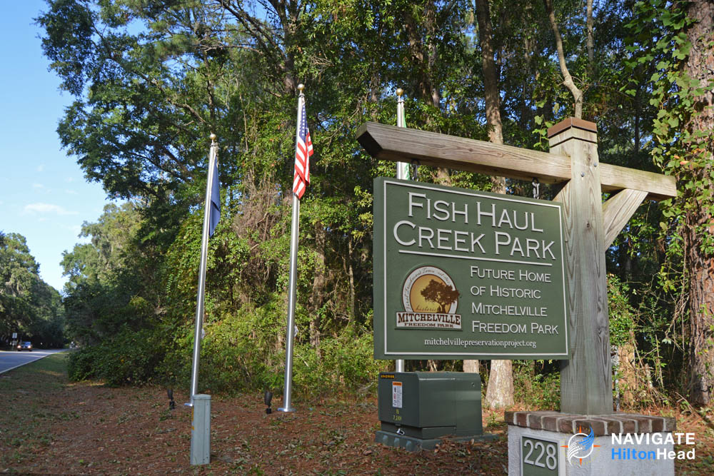 Sign displaying the Fish Haul Creek Park transition to the Historic Mitchelville Freedom Park 1000